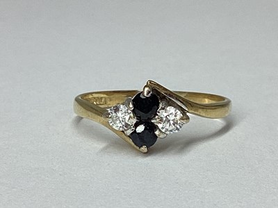 Lot 49 - A Dainty 9ct Gold Stone Set Twist Ring, the...