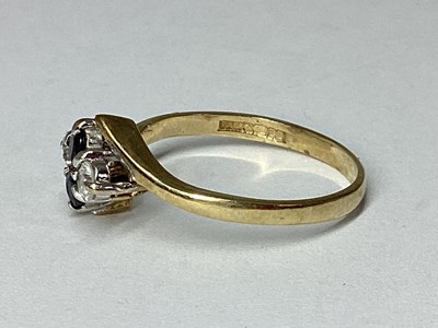 Lot 49 - A Dainty 9ct Gold Stone Set Twist Ring, the...