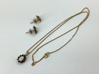 Lot 62 - A Dainty Oval Claw Set Cluster Pendant, to...