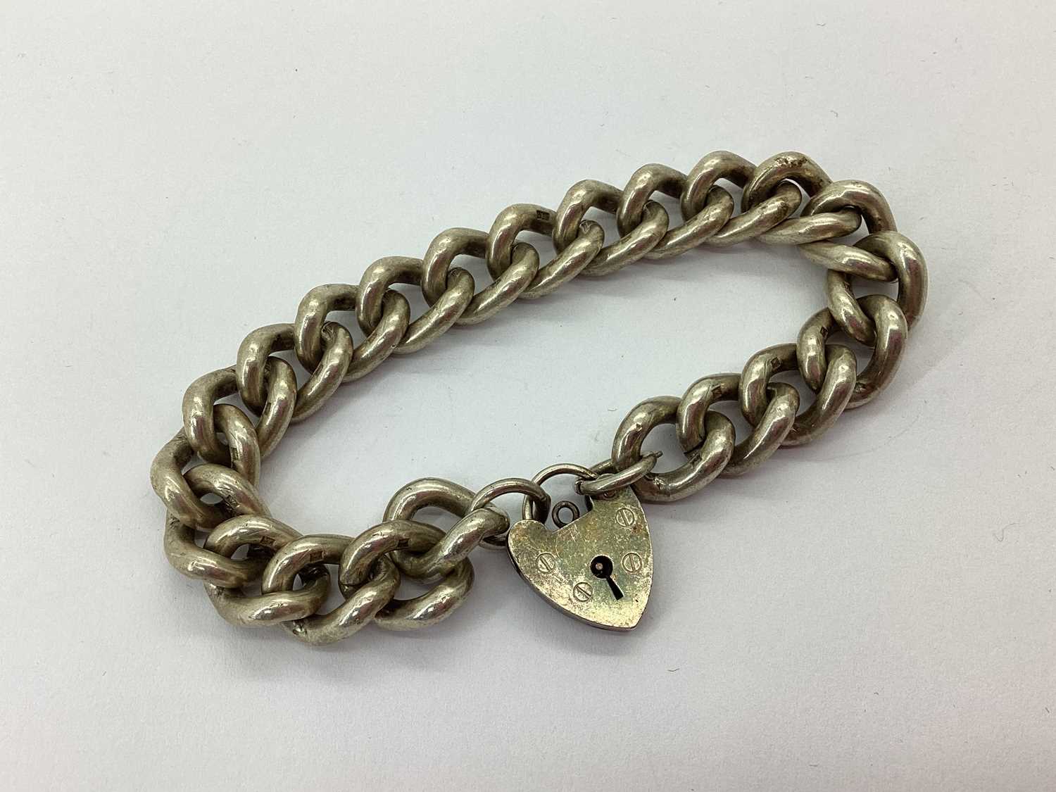 Lot 69 - A Chunky Hallmarked Silver Curb Bracelet,...
