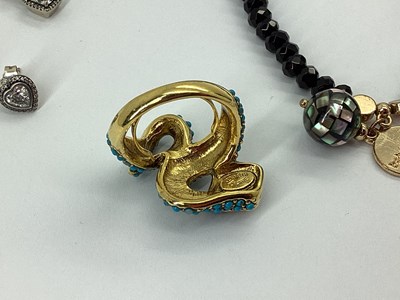 Lot 95 - Kenneth Jay Lane; A Decorative Serpent Ring,...