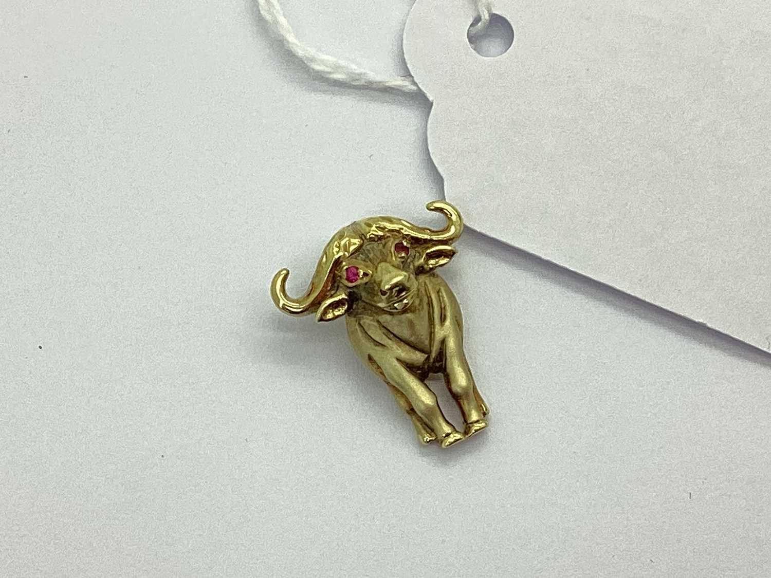 Lot 58 - A Novelty Cape Buffalo Pendant, of part-matte...
