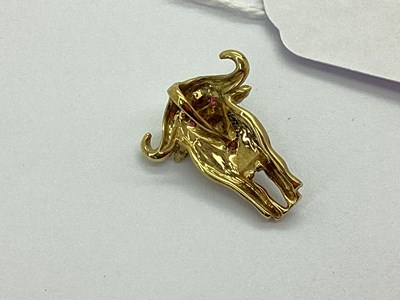 Lot 58 - A Novelty Cape Buffalo Pendant, of part-matte...