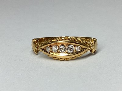 Lot 47 - An 18ct Gold Five Stone Diamond Boat Shape...