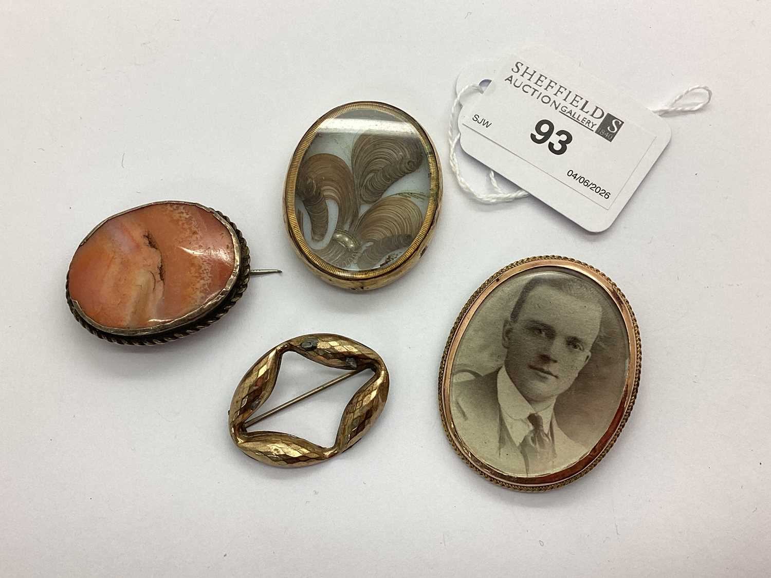 Lot 93 - An Antique Oval Locket Brooch, containing...