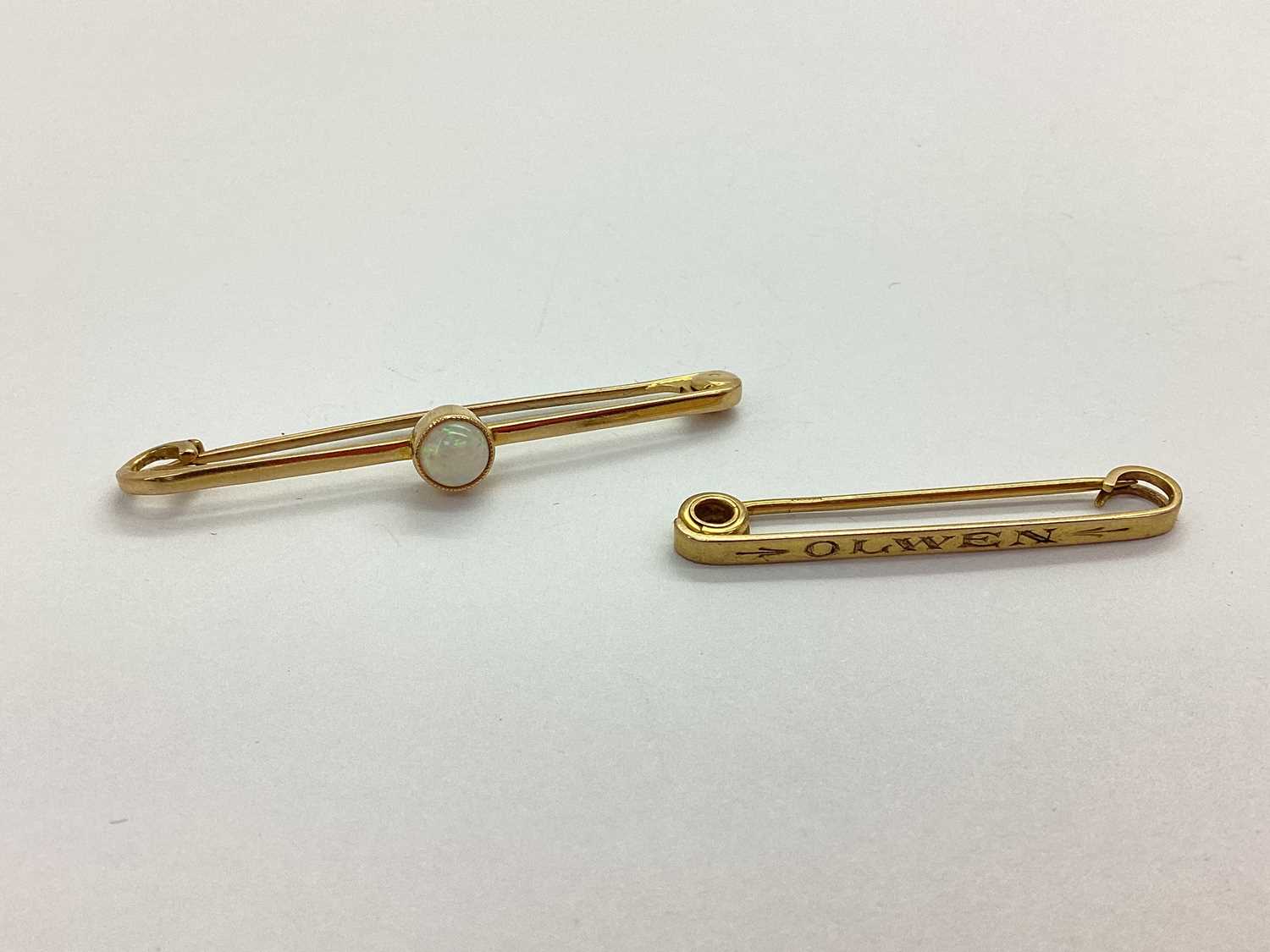 Lot 68 - A Cabochon Set Stock Pin, indistinctly stamped...