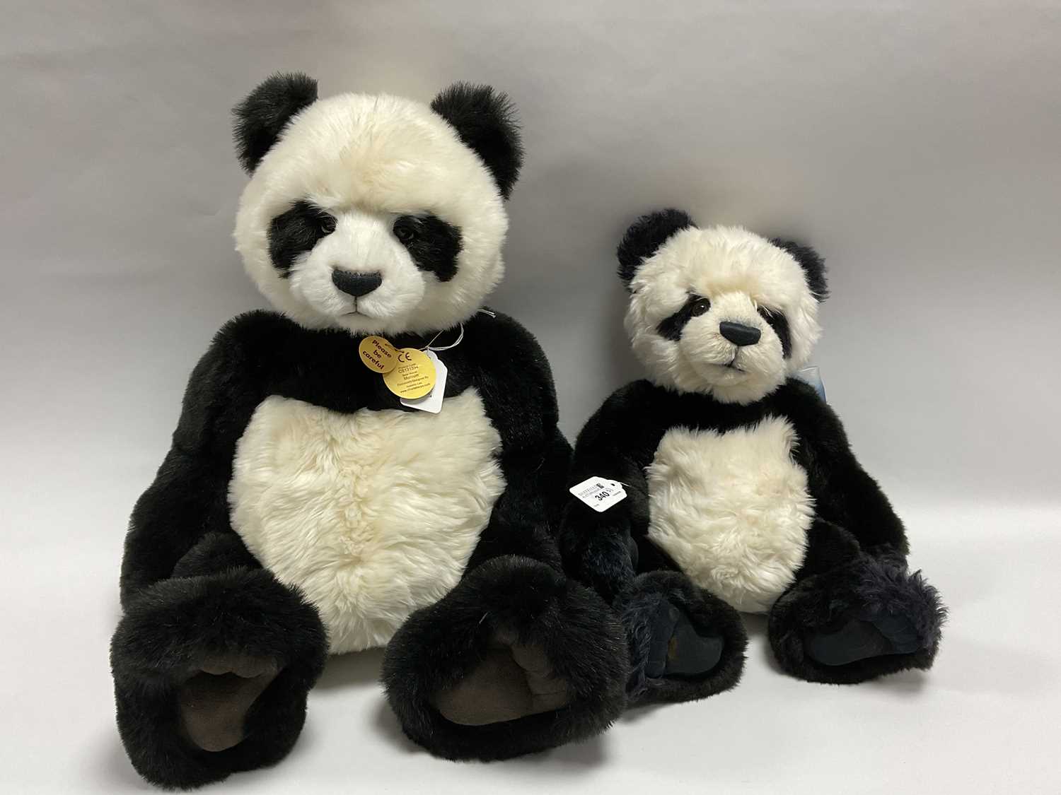 Lot 340 - Two Charlie Bears Panda Bears. Comprising of...