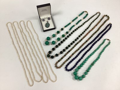 Lot 107 - An Opal Coloured Shard Mosaic Style Pendant,...