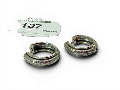 Lot 107 - A Pair of 9ct White Gold Hinged Huggy Style...