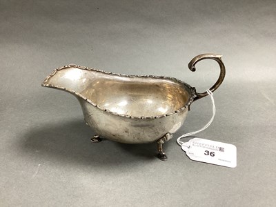 Lot 36 - An Edwardian Hallmarked Silver Sauce Boat,...