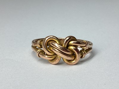 Lot 192 - A 9ct Rose Gold Double Knot Ring, between...