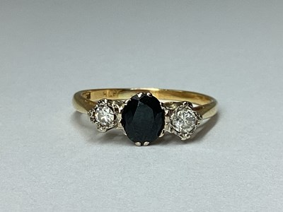 Lot 182 - A Graduated Three Stone Ring, claw set...