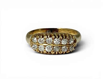Lot 175 - A Two Row Old Cut Diamond Ring, claw set...