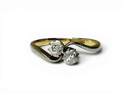 Lot 180 - A Two Stone Diamond Twist Ring, claw set...