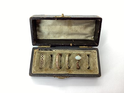 Lot 191 - A Dainty Rose Coloured Openwork Band Ring, the...
