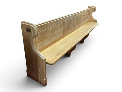 Lot 1469 - Pine Church Pew, with a panelled back, shaped...