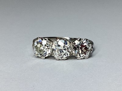 Lot 202 - A Three Stone Diamond Ring, the old brilliant...