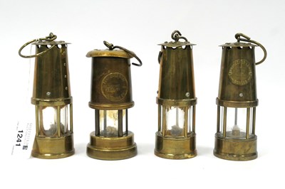 Lot 1241 - A Collection of Four Miniature Brass Miner's...