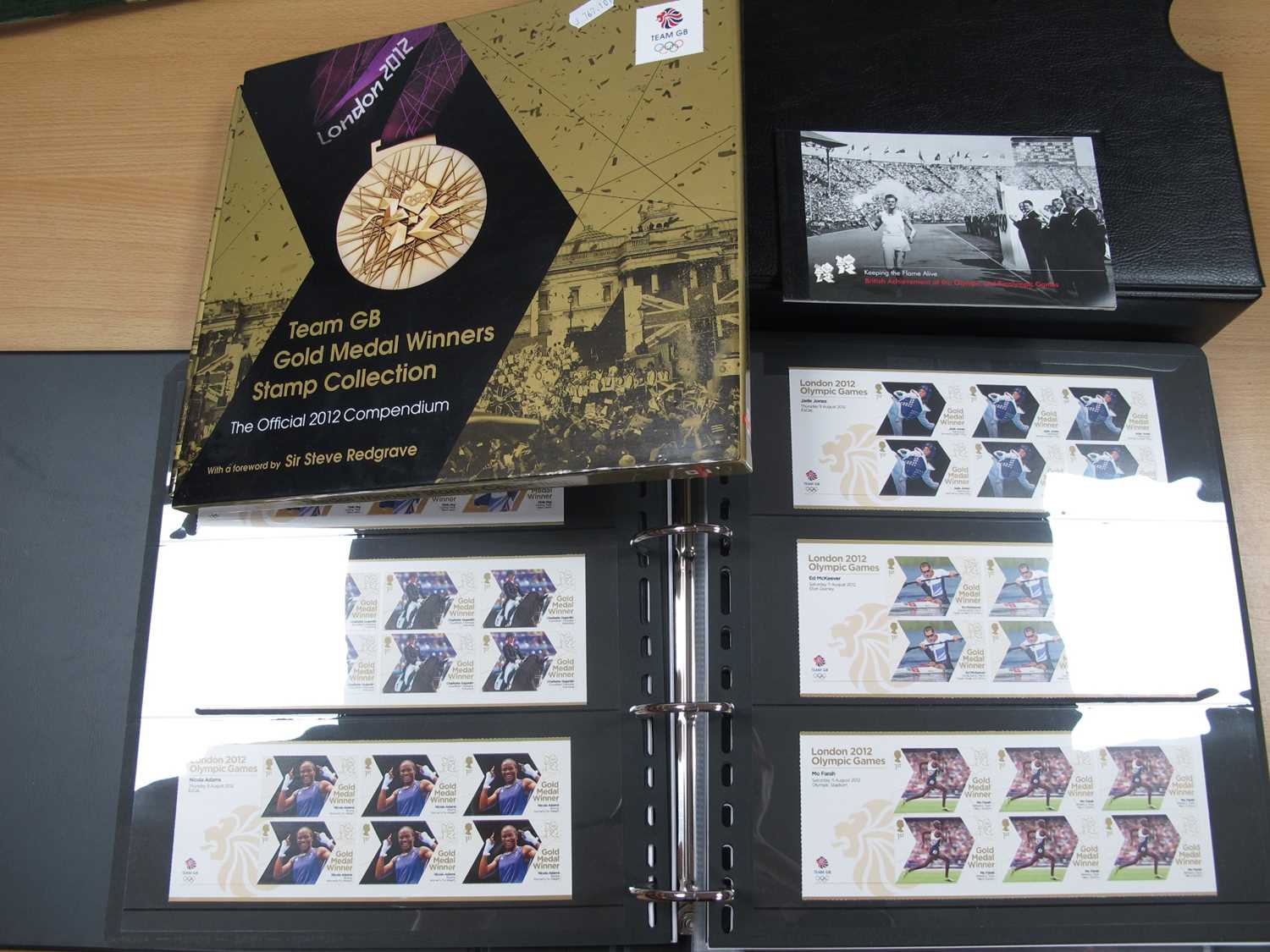 Lot 323 - Stamps; A Deluxe album containing a collection...