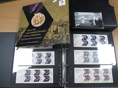 Lot 323 - Stamps; A Deluxe album containing a collection...