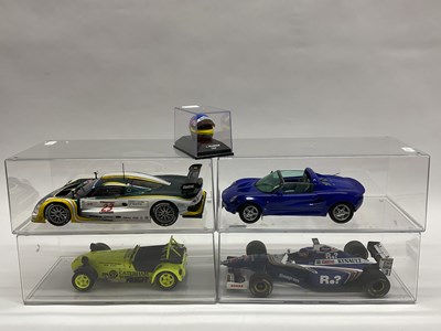 Lot 716 - Four 1:18 Scale Diecast Model Cars, comprising...