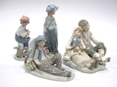 Lot 1075 - A Lladro Porcelain Figure of a Seated Boy and...