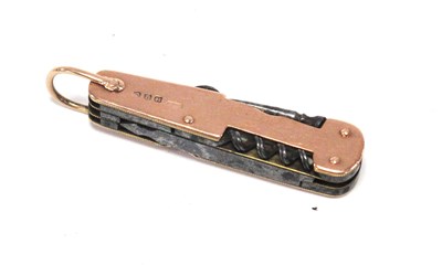 Lot 1328 - A 9ct Gold Seven Blade Pocket Knife, with...