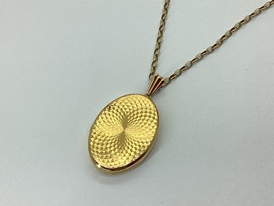 Lot 101 - A Modern 9ct Gold Oval Locket Pendant, of...
