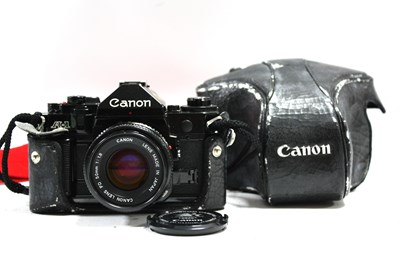 Lot 817 - Canon A-1 35mm SLR Film Camera, with attached...