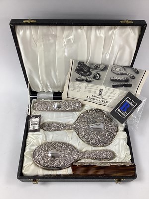 Lot 44 - A Cased Hallmarked Silver Four Piece Dressing...