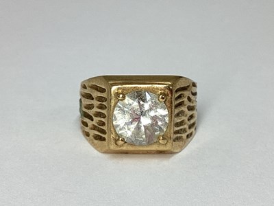 Lot 70 - A 9ct Gold Wide Textured Ring, with round claw...