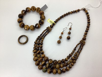 Lot 146 - A Three Strand Tiger's Eye Bead Collar...