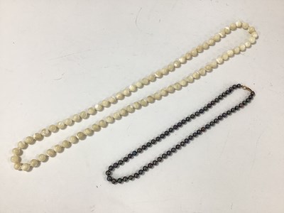 Lot 151 - A Black Pearl Bead Necklace, of uniform design,...