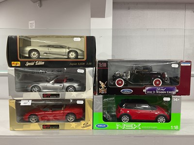 Lot 657 - Five 1:18th scale diecast model cars by UT...