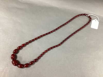 Lot 170 - A Cherry Amber Coloured Bead Necklace, of...