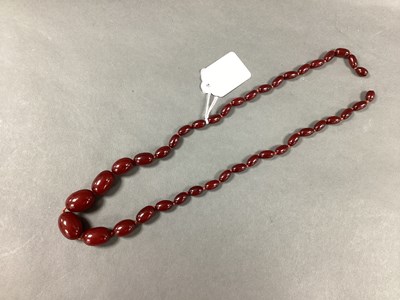Lot 169 - A Cherry Amber Coloured Bead Necklace, of...