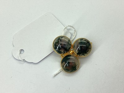 Lot 126 - A Moss Agate Cabochon Set Brooch, the three...