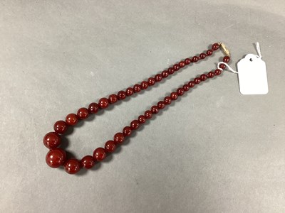 Lot 172 - A Cherry Amber Coloured Bead Necklace, of...