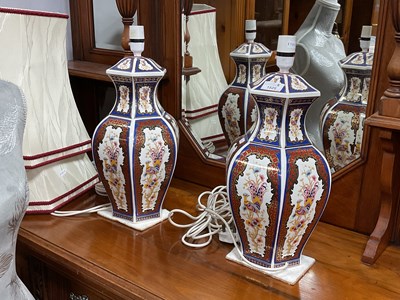 Lot 1525 - A pair of Imari-style porcelain table lamps,...