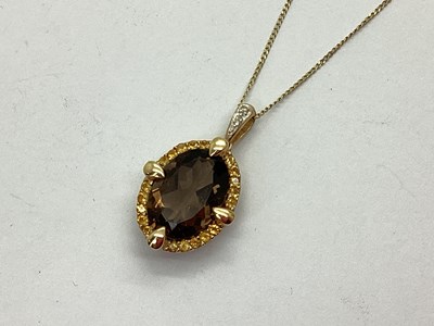 Lot 115 - A 9ct Gold Multi-Stone Cluster Pendant, the...