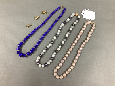 Lot 176 - A Graduated Polished Lapis Lazuli Bead...