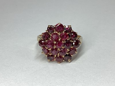 Lot 84 - A 9ct Gold Ruby Cluster Dres Ring, claw set...