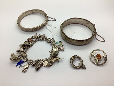 Lot 148 - A Fancy Link Charm Bracelet, suspending...
