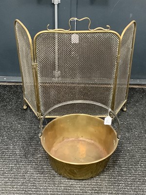 Lot 1558 - A large brass jam pot with cast iron handle,...