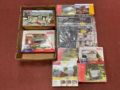 Lot 438 - Eight boxed HO scale plastic building and...