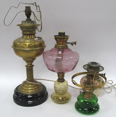 Lot 1378 - Vintage table lamps, including a brass oil...
