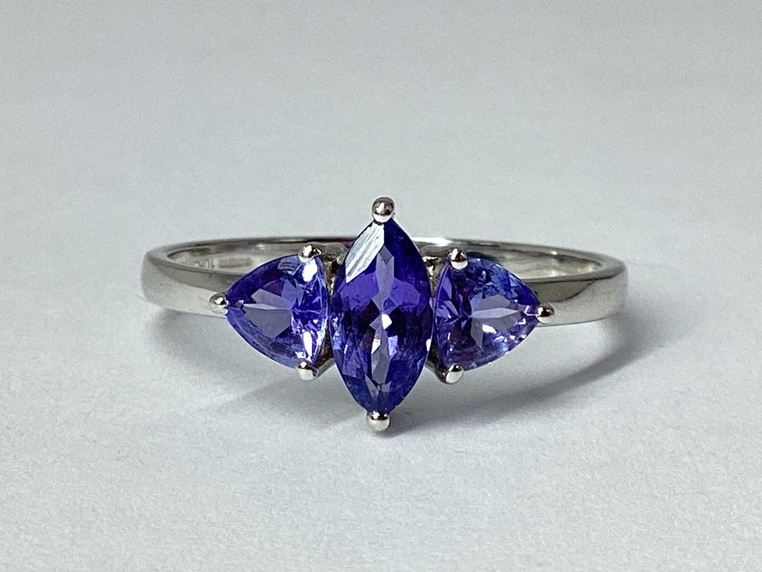 Lot 62 - A Modern 9ct White Gold Three Stone Dress Ring,...