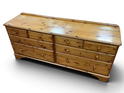 Lot 1569 - Ducal Pine Elongated Chest of Eight Various...