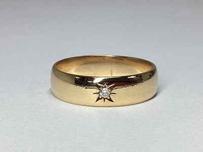 Lot 56 - A 9ct Gold Band, with single star set...