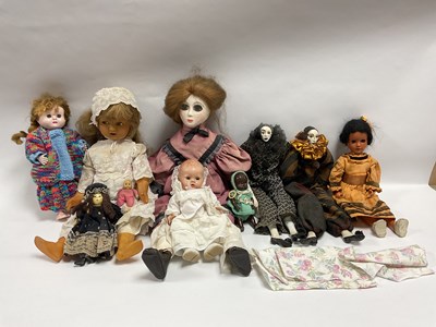 Lot 404 - Ten plastic, wooden and porcelain dolls, to...